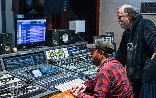 Two men in a recording studio.